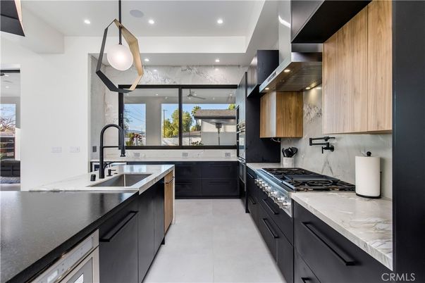Interior, Kitchen, Marble Walls, Pendant Lights, Recessed Lighting, Stainless Steel Appliances
