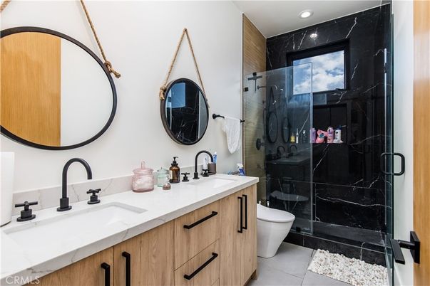 Bathroom, Dual Sink Vanities, Glass Shower, Interior, Marble Walls, Recessed Lighting