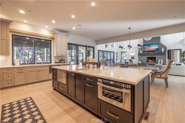 Dining room, Fireplace, Interior, Kitchen, Living room, Pendant Lights, Recessed Lighting, Stainless Steel Appliances, Wood Texture Flooring