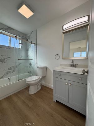 Bathroom, Glass Shower, Interior, Marble Walls, Recessed Lighting, Wood Texture Flooring