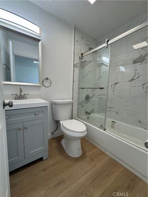 Bathroom, Glass Shower, Interior, Marble Walls, Wood Texture Flooring