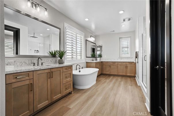 Bathroom, Dual Sink Vanities, Free Standing Baths, Glass Shower, Interior, Recessed Lighting, Wood Texture Flooring