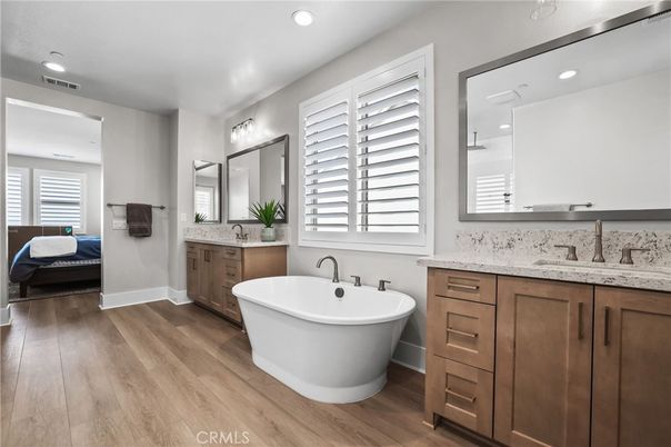 Bathroom, Dual Sink Vanities, Free Standing Baths, Interior, Recessed Lighting, Wood Texture Flooring