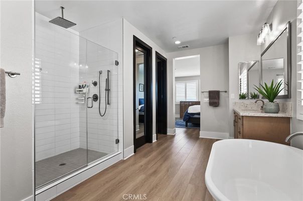 Bathroom, Free Standing Baths, Glass Shower, Interior, Recessed Lighting, Wood Texture Flooring