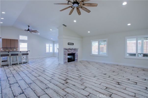 Empty room, Fireplace, Interior, Kitchen, Recessed Lighting, Wood Texture Flooring