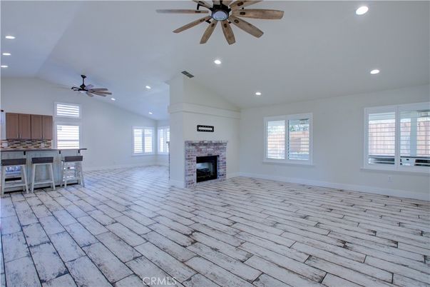Empty room, Fireplace, Interior, Kitchen, Recessed Lighting, Wood Texture Flooring