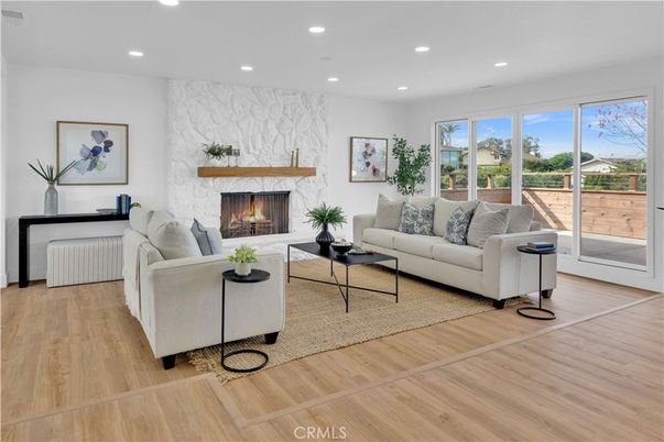 Fireplace, Interior, Living room, Marble Walls, Recessed Lighting, Wood Texture Flooring