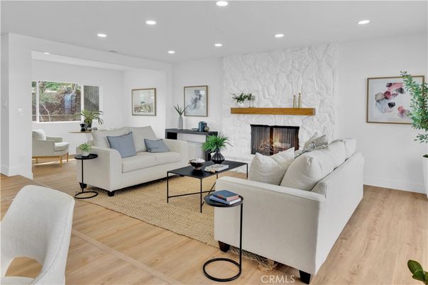 Fireplace, Interior, Living room, Marble Walls, Recessed Lighting, Wood Texture Flooring