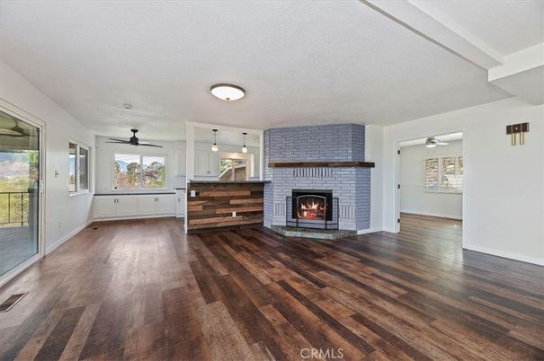 Empty room, Fireplace, Interior, Pendant Lights, Stone Walls, Wood Texture Flooring
