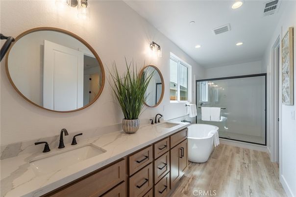 Bathroom, Dual Sink Vanities, Free Standing Baths, Glass Shower, Interior, Recessed Lighting, Wood Texture Flooring