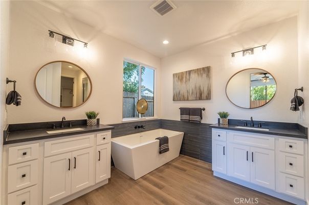 Bathroom, Dual Sink Vanities, Free Standing Baths, Interior, Recessed Lighting, Wood Texture Flooring