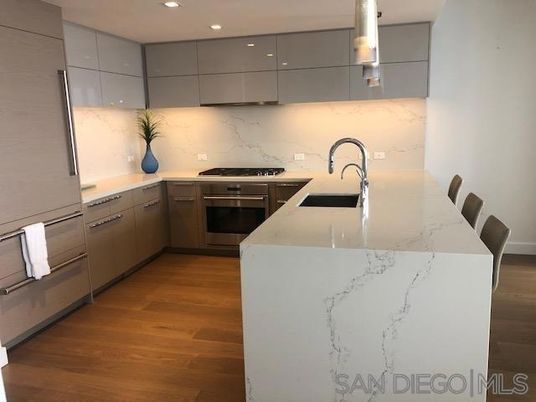 Interior, Kitchen, Marble Walls, Recessed Lighting, Stainless Steel Appliances, Wood Texture Flooring