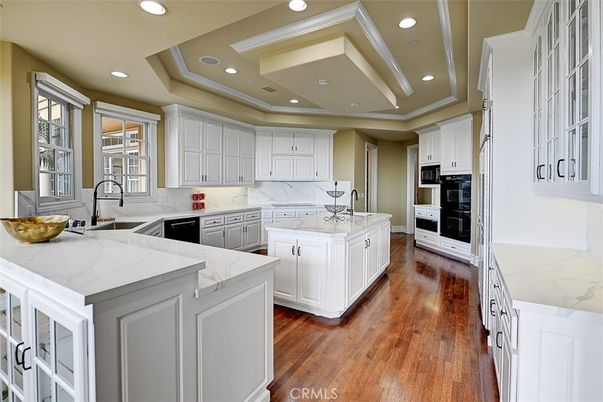Interior, Kitchen, Marble Walls, Recessed Lighting, Stainless Steel Appliances, Wood Texture Flooring