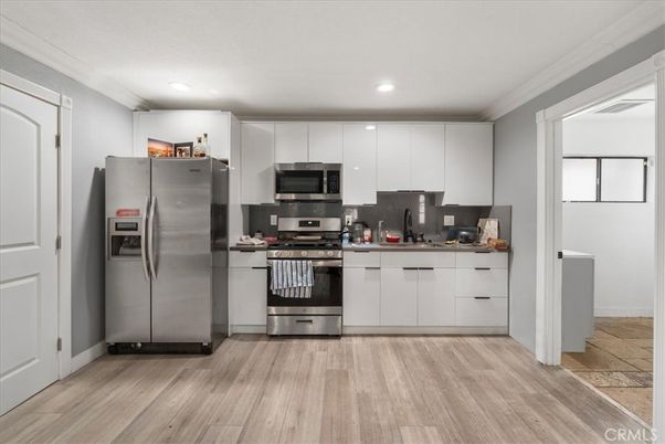 Interior, Kitchen, Recessed Lighting, Stainless Steel Appliances, Wood Texture Flooring