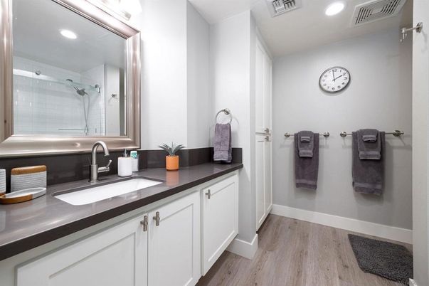 Bathroom, Dual Sink Vanities, Glass Shower, Interior, Recessed Lighting, Wood Texture Flooring