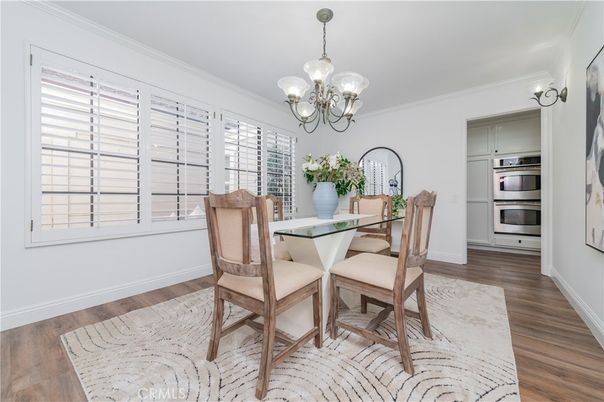 Chandelier, Dining room, Interior, Kitchen, Stainless Steel Appliances, Wood Texture Flooring