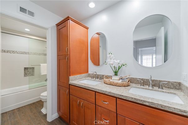 Bathroom, Dual Sink Vanities, Glass Shower, Interior, Recessed Lighting, Wood Texture Flooring