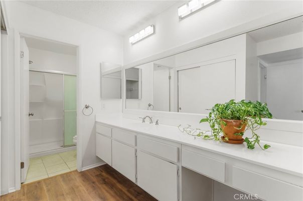 Bathroom, Dual Sink Vanities, Glass Shower, Interior, Wood Texture Flooring