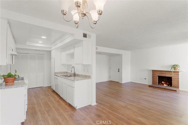Chandelier, Fireplace, Interior, Kitchen, Recessed Lighting, Wood Texture Flooring