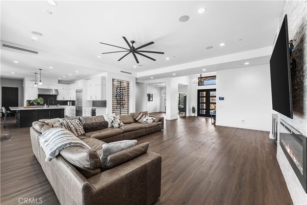 Fireplace, Interior, Kitchen, Living room, Pendant Lights, Recessed Lighting, Stainless Steel Appliances, Wood Texture Flooring