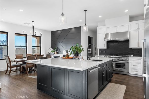 Dining room, Interior, Kitchen, Pendant Lights, Recessed Lighting, Stainless Steel Appliances, Wood Texture Flooring