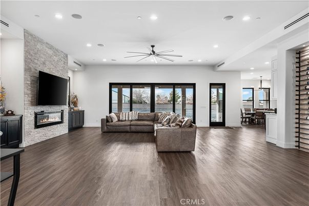 Dining room, Fireplace, Interior, Living room, Pendant Lights, Recessed Lighting, Stone Walls, Wood Texture Flooring