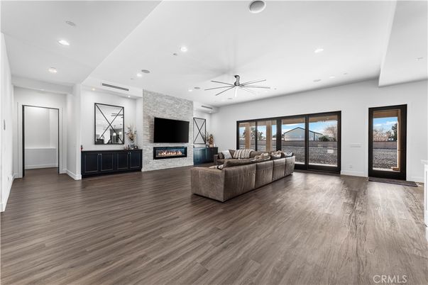 Fireplace, Interior, Living room, Recessed Lighting, Stone Walls, Wood Texture Flooring