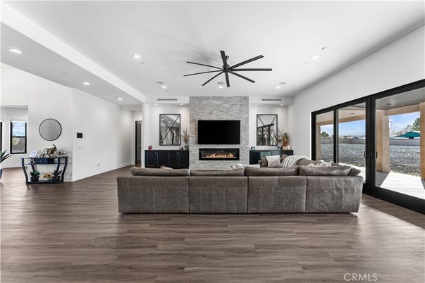 Fireplace, Interior, Living room, Recessed Lighting, Stone Walls, Wood Texture Flooring