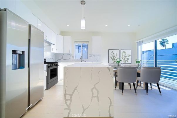 Interior, Kitchen, Marble Walls, Pendant Lights, Recessed Lighting, Stainless Steel Appliances