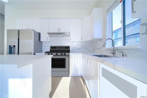 Interior, Kitchen, Marble Walls, Stainless Steel Appliances, Wood Texture Flooring