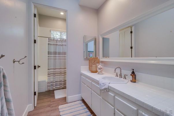 Bathroom, Interior, Recessed Lighting, Tile Countertops, Wood Texture Flooring