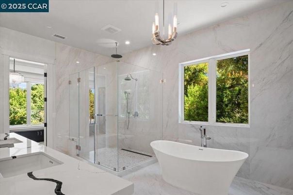 Bathroom, Free Standing Baths, Glass Shower, Interior, Marble, Marble Walls, Pendant Lights, Recessed Lighting