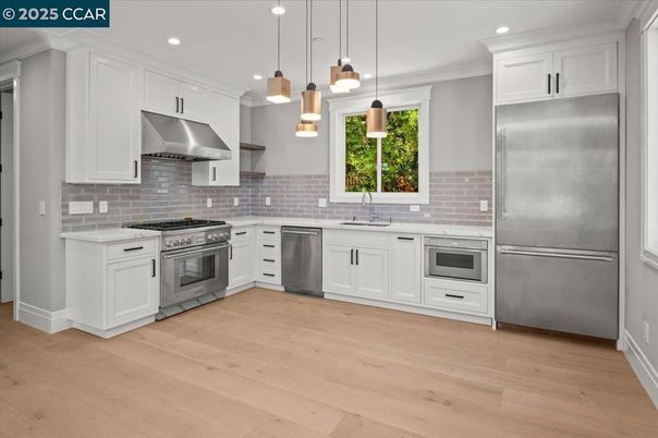 Interior, Kitchen, Pendant Lights, Recessed Lighting, Stainless Steel Appliances, Stone Walls, Wood Texture Flooring
