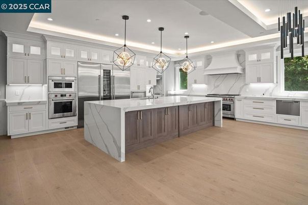 Chandelier, Interior, Kitchen, Pendant Lights, Recessed Lighting, Stainless Steel Appliances, Wood Texture Flooring