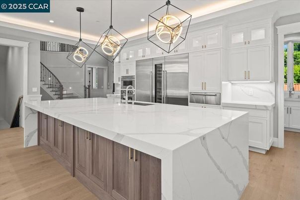 Dining room, Fireplace, Interior, Kitchen, Living room, Marble Walls, Pendant Lights, Recessed Lighting, Stainless Steel Appliances, Wood Texture Flooring