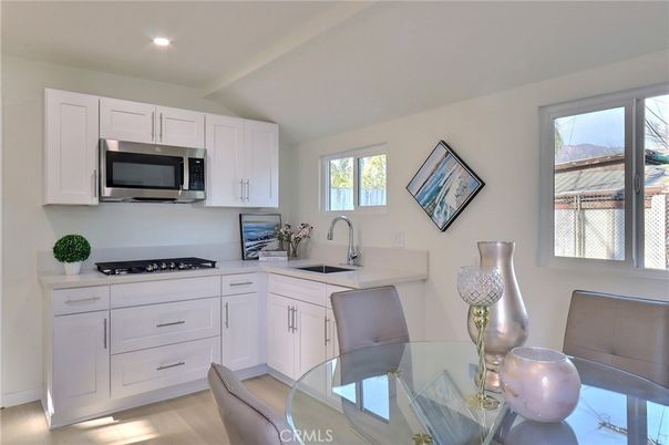 Dining room, Interior, Kitchen, Recessed Lighting, Stainless Steel Appliances, Wood Texture Flooring