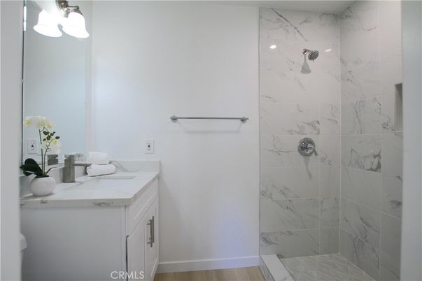 Bathroom, Glass Shower, Interior, Marble Walls, Wood Texture Flooring