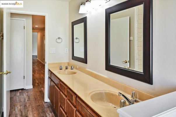 Bathroom, Dual Sink Vanities, Interior, Recessed Lighting, Wood Texture Flooring