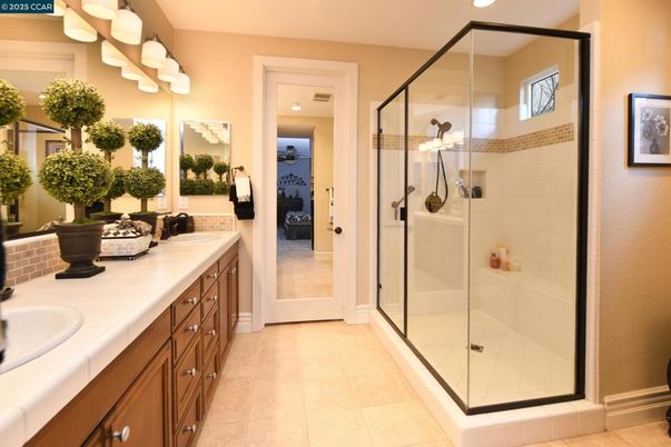 Bathroom, Dual Sink Vanities, Glass Shower, Interior, Recessed Lighting, Tile Countertops