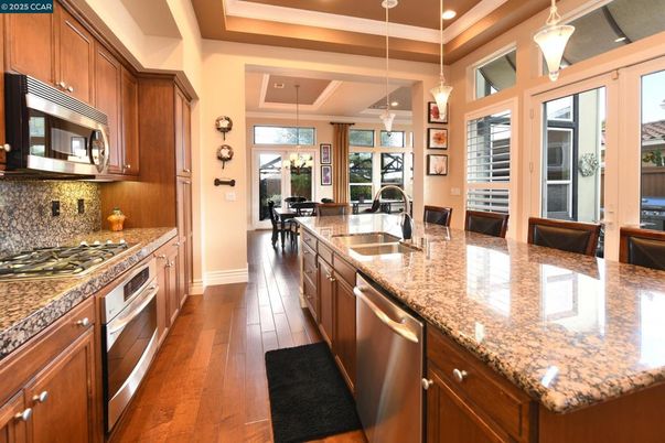 Chandelier, Interior, Kitchen, Pendant Lights, Recessed Lighting, Stainless Steel Appliances, Wood Texture Flooring