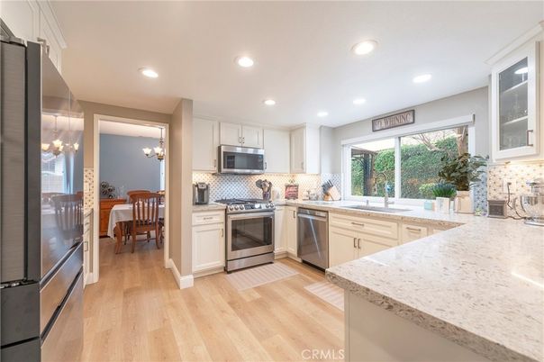 Chandelier, Dining room, Interior, Kitchen, Recessed Lighting, Stainless Steel Appliances, Wood Texture Flooring
