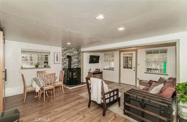 Dining room, Fireplace, Interior, Living room, Recessed Lighting, Wood Texture Flooring