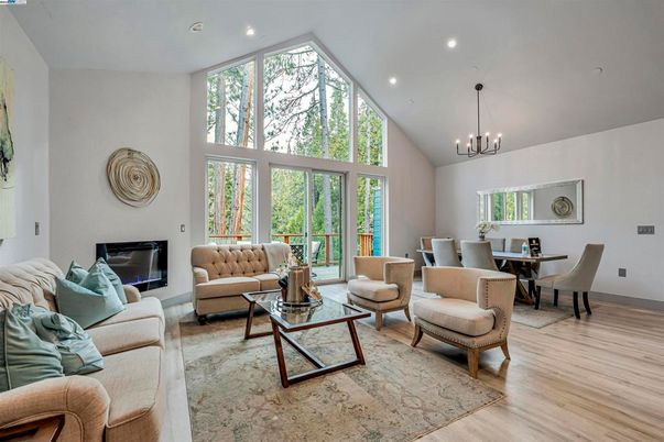 Chandelier, Dining room, Fireplace, Interior, Living room, Pendant Lights, Recessed Lighting, Wood Texture Flooring