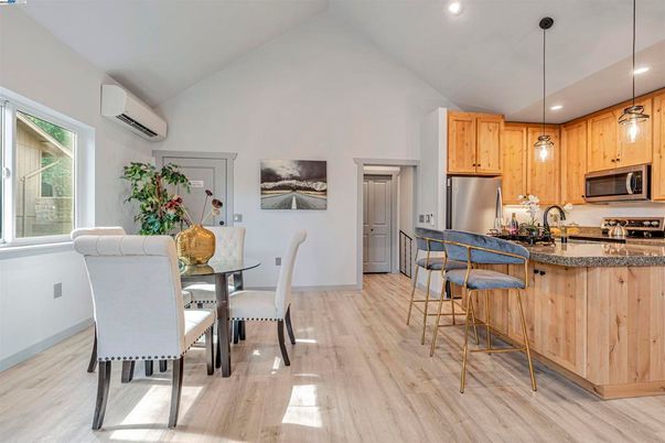 Dining room, Interior, Kitchen, Pendant Lights, Recessed Lighting, Stainless Steel Appliances, Wood Texture Flooring