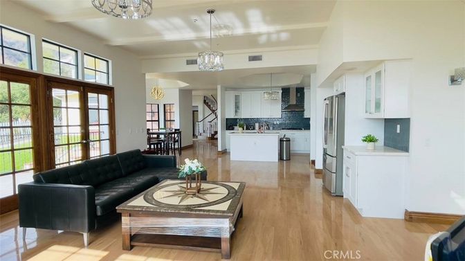 Chandelier, Dining room, Interior, Kitchen, Living room, Pendant Lights, Stainless Steel Appliances, Wood Texture Flooring