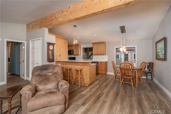 Dining room, Interior, Kitchen, Pendant Lights, Recessed Lighting, Stainless Steel Appliances, Wooden Beams, Wood Texture Flooring