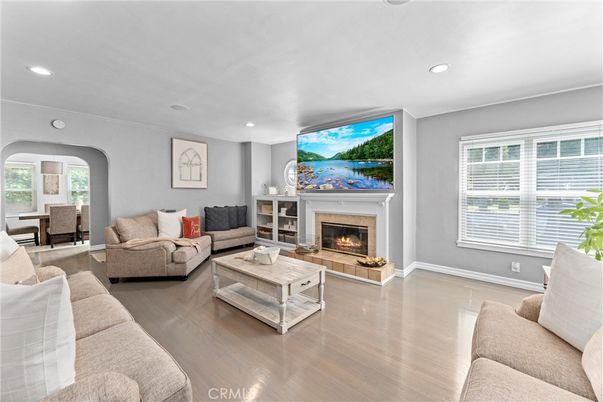 Dining room, Fireplace, Interior, Living room, Recessed Lighting, Wood Texture Flooring