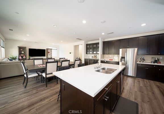 Dining room, Interior, Kitchen, Living room, Recessed Lighting, Stainless Steel Appliances, Wood Texture Flooring