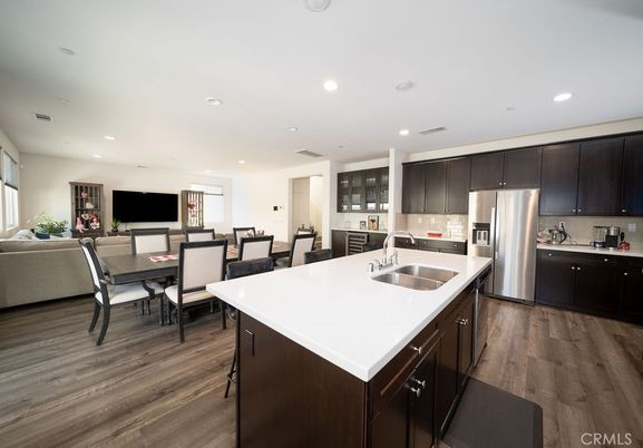 Dining room, Interior, Kitchen, Living room, Recessed Lighting, Stainless Steel Appliances, Wood Texture Flooring
