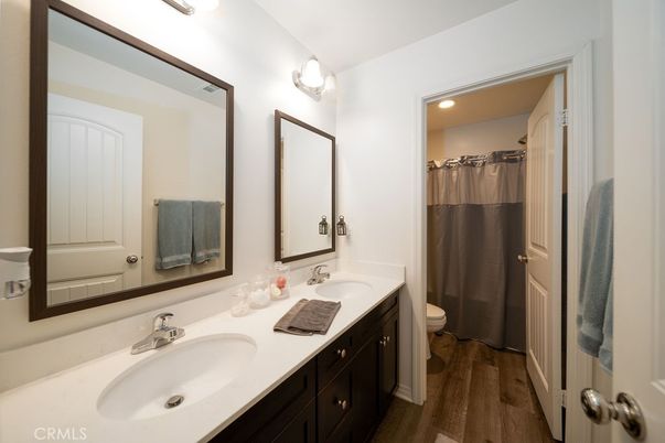 Bathroom, Dual Sink Vanities, Interior, Recessed Lighting, Wood Texture Flooring